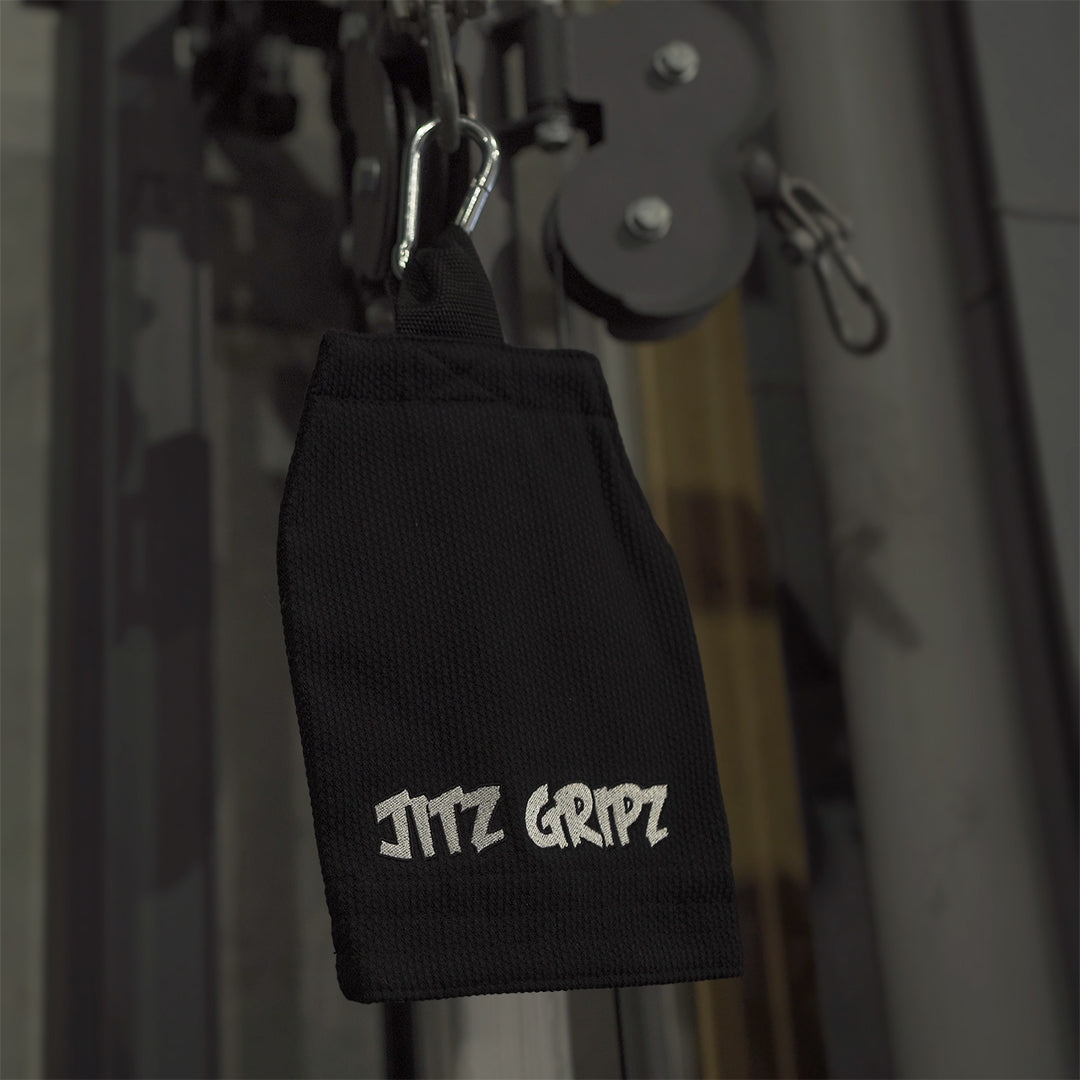 JitzGripz Gi sleeve grip trainer attached to gym cable machine