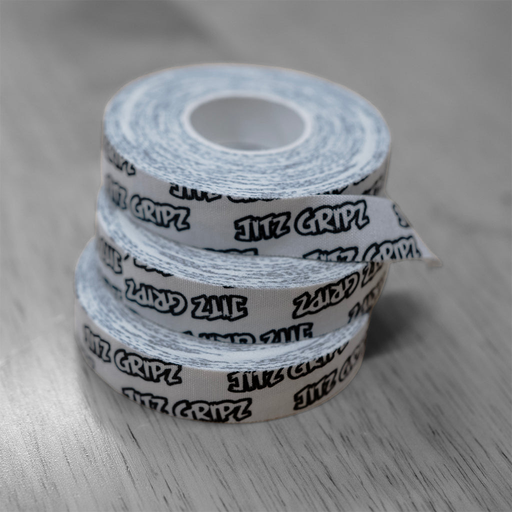 Close-up texture of breathable cotton JitzGripz finger tape for grapplers